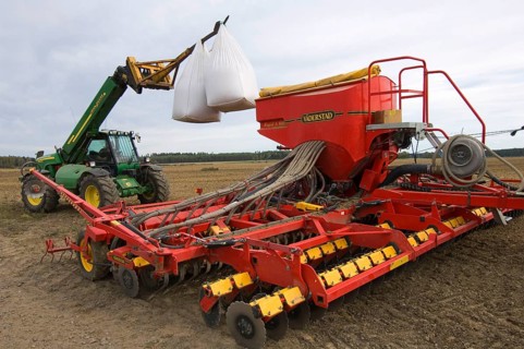 John Deere 3400 telescopic handler with bags of wheat seed loaded with Vaderstad drill