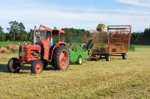 Tractor baling hay