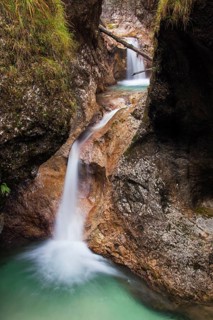 Waterfall in the Almbach river flowing through the Almbachklamm gorge in the Berchtesgaden Alps