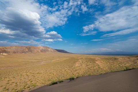 Aktau Mountains seen from the Singing Dunes
