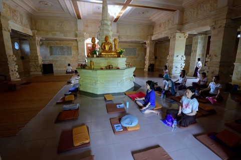 Believers meditate in prayer room