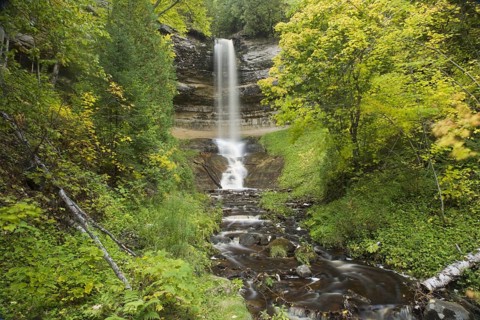 Waterfall flowing over a sandstone cliff