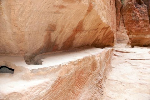 Restored ancient water conduit in Siq