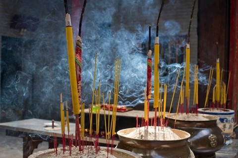 Incense sticks burning on incense pot