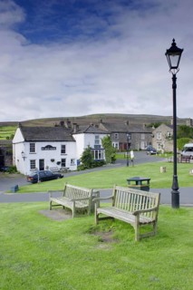 Village green with benches and lamppost