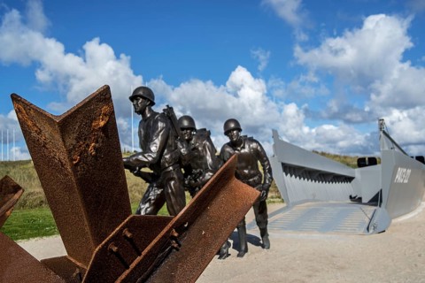 Czech hedgehog and landing craft in front of the Musee du Debarquement Utah Beach