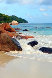 Beach and rocks of Anse Lazio in the evening