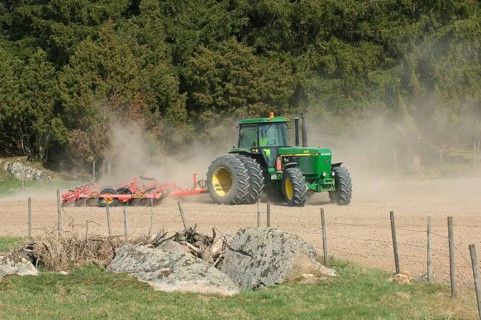 John Deere 4455 tractor pulling Vaderstad cultivator