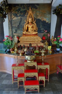 Buddha statue on an altar in a prayer room of the Buddhist monastery Brahma Vihara