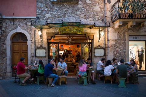 People sitting in front of restaurant