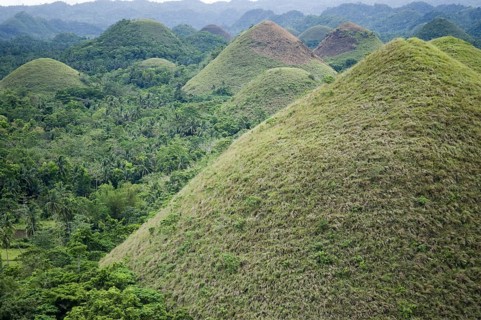 Cone-shaped karst hills of grass-covered limestone