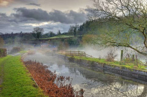 View of mist over the canal aquaduct at dusk
