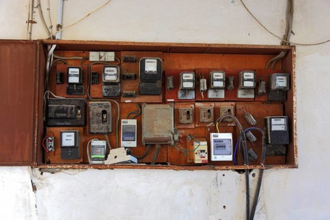 Several electricity meters on one wall