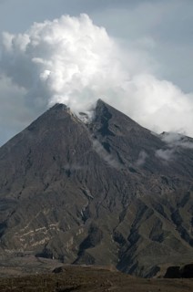Recently erupted volcano with ash clouds