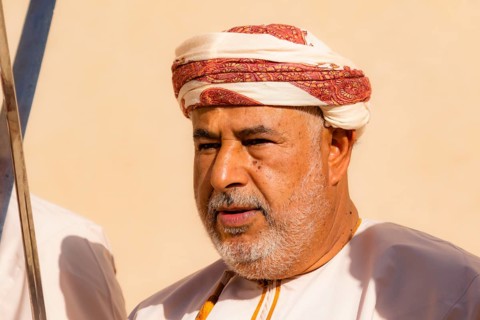 Man performing traditional songs during the Friday Goat Market in Nizwa