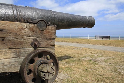 18th Century 18-pounder gun on seafront of seaside town