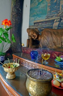 Reclining Buddha statue on an altar in a prayer room of the Brahma Vihara Buddhist monastery