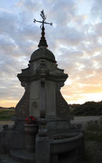 Memorial drinking fountain at sunset