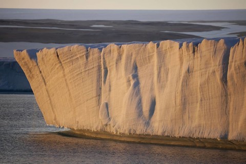 View of the end of the coastal glacier at sunset
