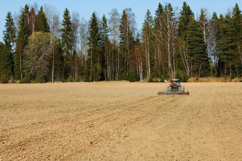 Harrow pulling tractor