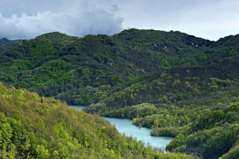 View of wooded hills and lake