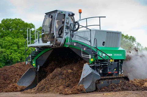 Komptech self-propelled compost turner turning rotting bedding manure