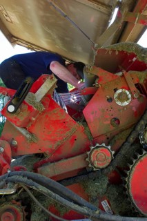 Farmer working on round baler