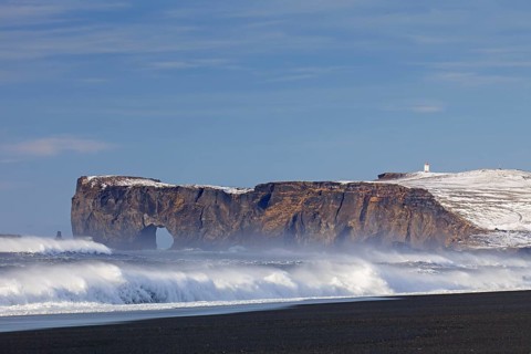 Black lava arc near Vik i Myrdal on the Dyrholaey peninsula in winter