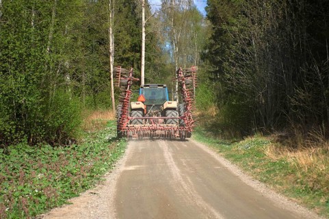 Tractor with harrow