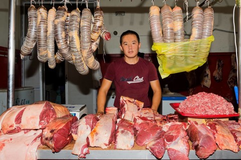 Kazakh man selling meat