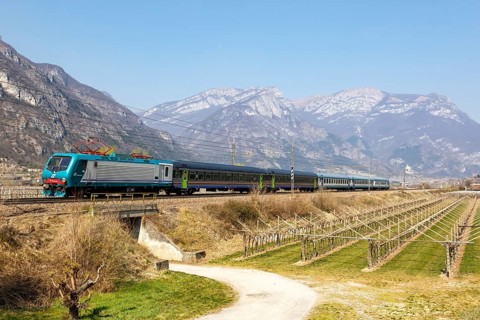 Trenitalia EuroCity train on the Brenner railway near Avio in Italy