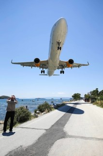 An Airbus A321 aircraft of Thomas Cook Airlines with registration G-TCDD lands at Skiathos airport