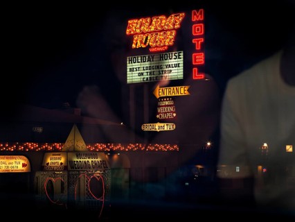 View from bus of neon lights and two hearts