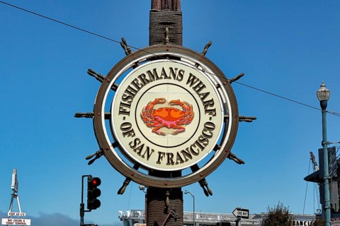 Fisherman's Wharf logo with crab symbol