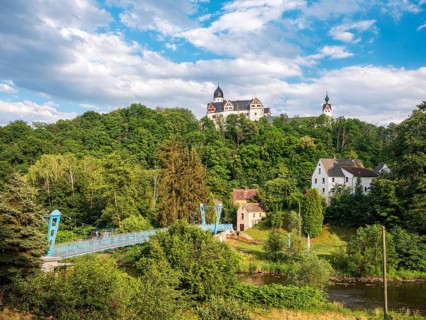 Rochsburg village and castle with suspension bridge over the Zwickauer Mulde