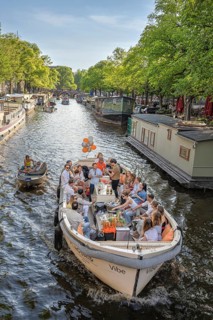 Party atmosphere on a tourist boat in the canals