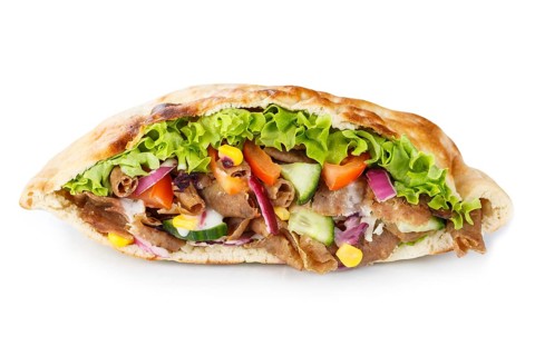 Doener Kebab Doner Kebap fast food in a flatbread cut out against a white background in Stuttgart