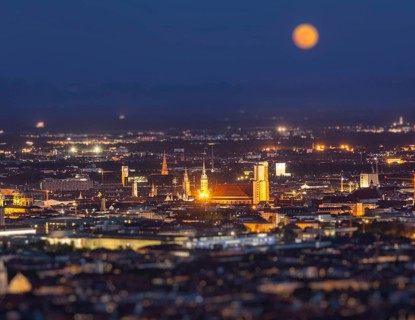 Night aerial view of Munich from Olympiaturm Olympic Tower with tilt shift toy effect shallow depth of field. Munich