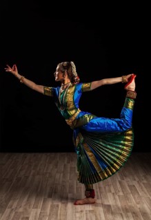 Young beautiful woman dancer exponent of Indian classical dance Bharatanatyam