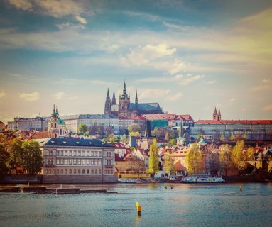 Vintage retro hipster style travel image of Charles bridge over Vltava river and Gradchany