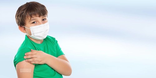 Child Boy with Plaster at Children Vaccination Mask against Coronavirus Corona Virus copy space Copyspace in Stuttgart