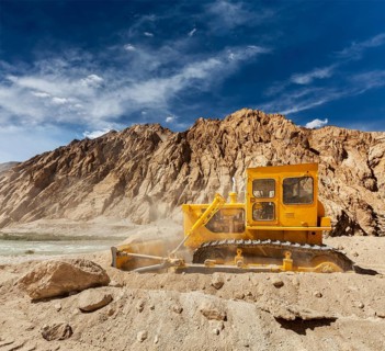 Bulldozer doing road construction in Himalayas. Ladakh