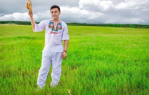 Man wearing Central American folk costume. Young man in cultural and folk costume from Nicaragua. Concept of man in Nicaraguan folk costume