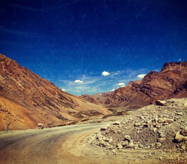 Vintage retro effect filtered hipster style travel image of Manali-Leh road to Ladakh in Indian Himalayas with grunge texture overlaid. Ladakh