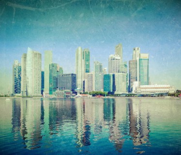 Modern city skyline of business district downtown of Singapore in day with grunge texture overlaid