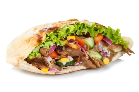 Doener Kebab Doner Kebap fast food in a flatbread cut out against a white background in Stuttgart