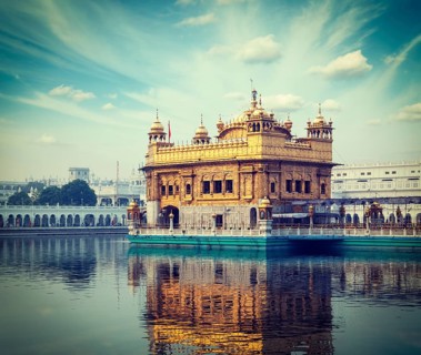 Vintage retro hipster style travel image of Sikh gurdwara Golden Temple