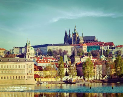 Vintage retro hipster style travel image of Mala Strana and Prague castle over Vltava river. Prague