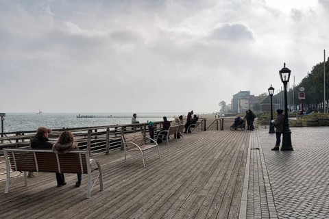 Pedestrians sitting on benches