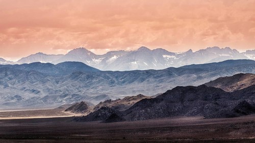 Backlit blue mountain ranges